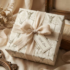 Vintage angel wrapping paper with a beige ribbon and gift tag for baptism or communion by Wrapped Studios.