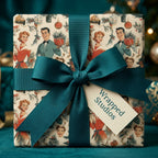 Vintage Christmas wrapping paper with a 1950s retro print and teal ribbon by Wrapped Studios.