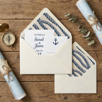 Nautical rope pattern wrapping paper as wedding envelope liners on rustic wood by Wrapped Studios.