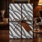 Nautical rope wrapping paper with a leather bow on a masculine birthday gift by Wrapped Studios.