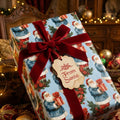 Vintage Christmas wrapping paper with blue Santa pattern and red velvet bow by Wrapped Studios.