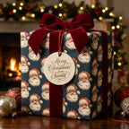 Vintage Santa Christmas wrapping paper in navy blue with a red velvet bow by Wrapped Studios.