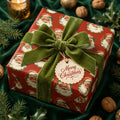 Vintage Santa Christmas wrapping paper with a green velvet bow on a holiday gift by Wrapped Studios.