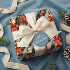 Blue vintage Santa Christmas wrapping paper with a cream bow on a holiday gift by Wrapped Studios.