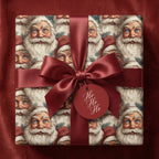 Wrapped gift with Santa Christmas wrapping paper and red ribbon.