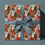 Vintage Santa Christmas wrapping paper on a gift box with a dusty blue satin bow, by Wrapped Studios.