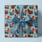 Vintage Santa blue Christmas gift wrap with a satin ribbon bow on a box by Wrapped Studios.