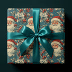 Vintage Santa wrapping paper with a teal satin bow on a luxury Christmas gift box by Wrapped Studios.