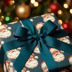 Vintage Santa Claus Christmas wrapping paper with a teal bow by Wrapped Studios, set against warm lights.