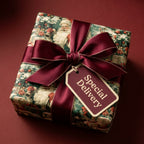 Vintage Santa Claus Christmas gift wrap with a luxury burgundy ribbon and Special Delivery tag by Wrapped Studios.