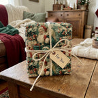 Vintage Christmas gift wrap featuring Santa Claus, tied with rustic twine and a "For You" tag by Wrapped Studios.