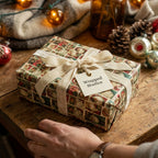 Vintage Santa Christmas wrapping paper by Wrapped Studios on a gift with a cream velvet ribbon.