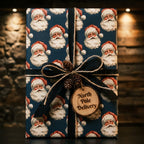 Vintage Santa Claus Christmas gift wrap with a black ribbon and rustic wood tag by Wrapped Studios.