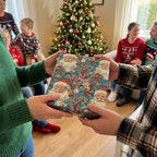 Giving a gift wrapped in vintage Santa Claus Christmas gift wrap tied with baker's twine.