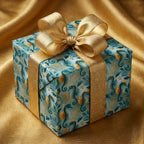 Luxury seahorse wrapping paper in teal and gold with a metallic bow by Wrapped Studios.