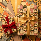 Retro wrapping paper by Wrapped Studios featuring 1950s movie icon and popcorn pattern with gold and red bows.