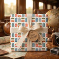 Vintage travel wrapping paper with suitcase pattern and Bon Voyage tag by Wrapped Studios.