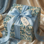 Luxury blue and gold floral wrapping paper with elegant satin bow, by Wrapped Studios.