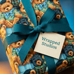 Vintage teddy bear wrapping paper with a teal ribbon and Wrapped Studios tag.