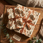 Vintage turkey Thanksgiving wrapping paper with copper ribbon on rustic gifts by Wrapped Studios.
