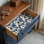 Blue and cream toile wrapping paper used as a decorative drawer liner by Wrapped Studios.