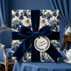 Luxury vintage blue toile wrapping paper with a navy velvet bow by Wrapped Studios.