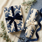 Vintage blue toile wrapping paper by Wrapped Studios, featuring luxury gifts with velvet and satin bows.