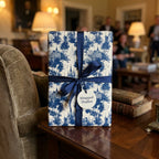 Vintage blue and white toile wrapping paper with a navy ribbon, luxury gift wrap by Wrapped Studios.