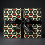 Retro vinyl record wrapping paper by Wrapped Studios, with a black satin bow on a music themed gift.