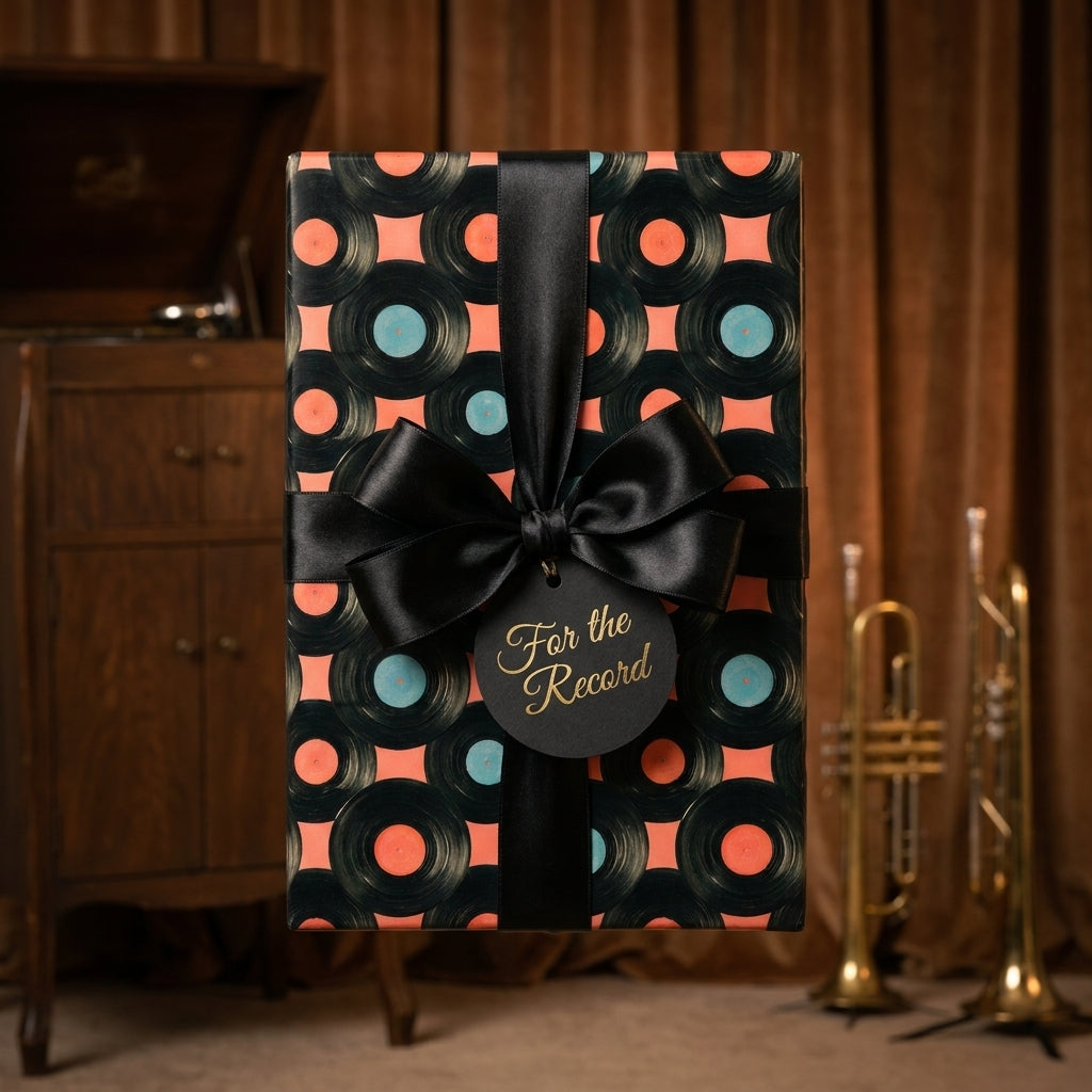 Retro vinyl record wrapping paper with a black satin bow by Wrapped Studios.