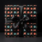 Retro vinyl record wrapping paper with a black satin bow by Wrapped Studios.