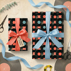 Retro vinyl record wrapping paper with satin ribbons on music themed gifts by Wrapped Studios.