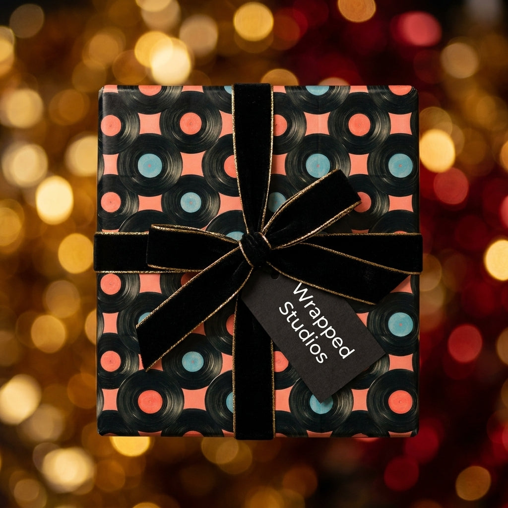 Retro vinyl record wrapping paper with black velvet ribbon on a gift box, by Wrapped Studios.