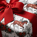 Equestrian Christmas wrapping paper with horses and red bow, western holiday gift wrap by Wrapped Studios.