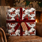 Western horse Christmas wrapping paper with red velvet bow on a rustic gift box by Wrapped Studios.