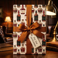 Vintage whiskey wrapping paper with brown ribbon and tag, luxury mens gift wrap by Wrapped Studios.