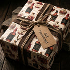 Vintage whiskey wrapping paper by Wrapped Studios on a rustic gift box with burlap ribbon and twine.