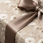 Vintage floral wrapping paper in cream and beige with a luxury taupe satin bow by Wrapped Studios.