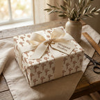 Rustic farmhouse windmill wrapping paper with a cream bow on a gift box, by Wrapped Studios.