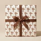 Rustic farmhouse wrapping paper with vintage windmill pattern and brown ribbon bow by Wrapped Studios.