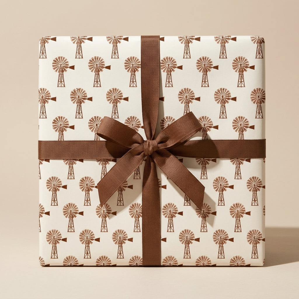 Rustic farmhouse wrapping paper with vintage windmill pattern and brown ribbon bow by Wrapped Studios.