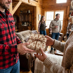 Rustic windmill wrapping paper by Wrapped Studios on a gift being exchanged in a cozy cabin.