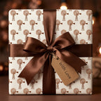 Rustic windmill gift wrap with a brown satin bow and 'With Love' tag by Wrapped Studios.