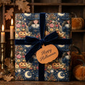 Vintage witch and pumpkin Halloween wrapping paper with a navy velvet bow by Wrapped Studios.