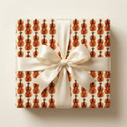 Music themed violin wrapping paper with a luxury cream satin bow by Wrapped Studios.
