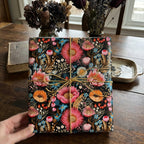 Floral gift wrap from Wrapped Studios. Square gift with colorful flower pattern and rustic twine.