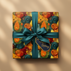 Gift wrapped in abstract, colorful designer wrapping paper with teal satin ribbon and tag.