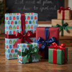 Back to school wrapping paper with colorful backpack pattern on blue gift boxes by Wrapped Studios.
