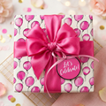 Pink balloon birthday wrapping paper with satin ribbon and "Let's Celebrate!" tag from Wrapped Studios.