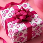 Pink balloon birthday wrapping paper with matching ribbon and bow.